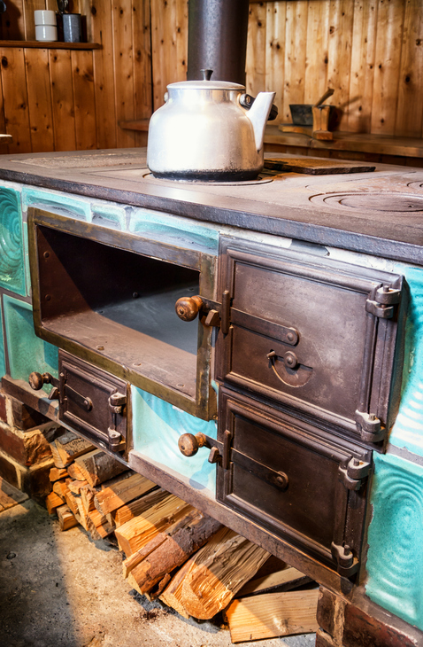 An old wood cook stove in a farmhouse kitchen