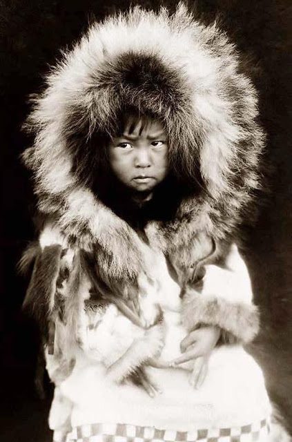 He has a grumpy sad face. An Eskimo child, 1929
