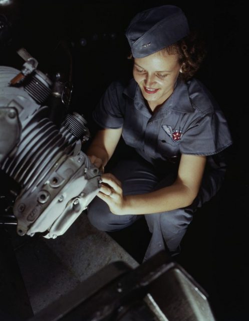 Mechanic Mary Josephine Farley checks a Wright Whirlwind motor at the Assembly and Repairs Department at the naval base.