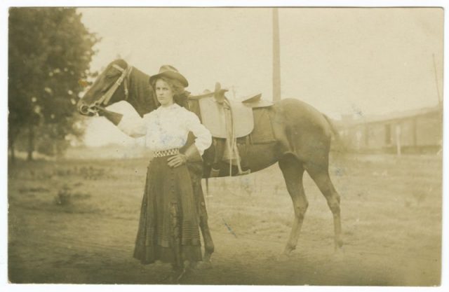 A cowgirl with her horse, likely the first decade of the 20th century.