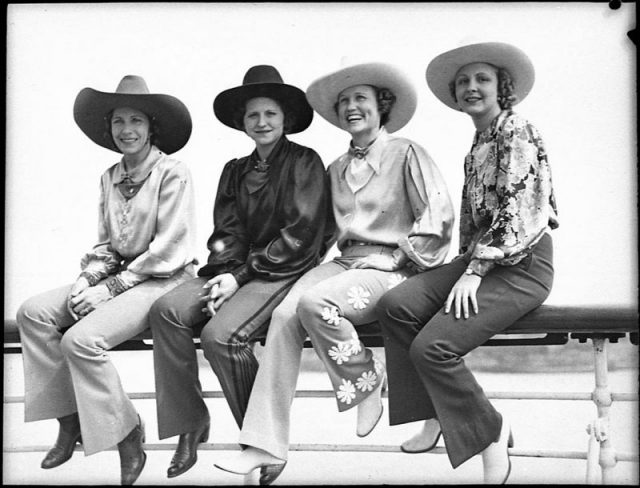 Cowgirls, sitting on the fence, 1939.
