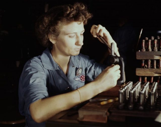 Back at the Assembly and Repair Department, Doris Duke works on reconditioning spark plugs.