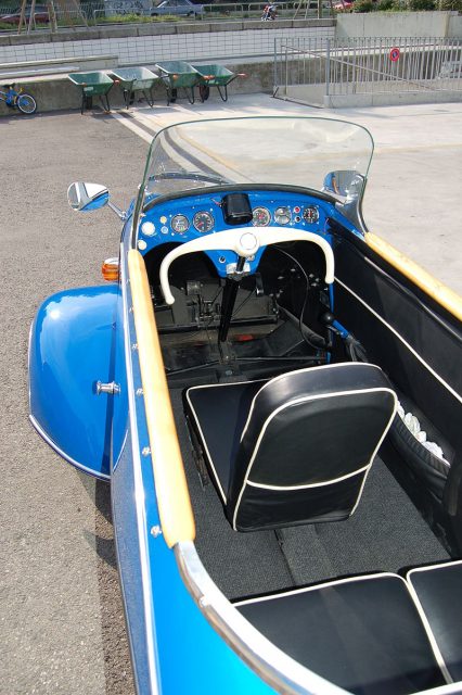 Painted blue, with neat leather seats, the interior of an elegant Messerschmitt three-wheeler, Photo by Norbert Aepli CC BY 2.5