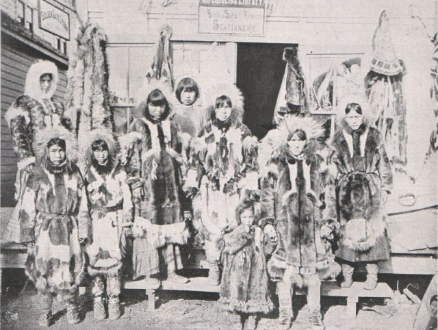 A group photo of Inuit people, all armored with fur.