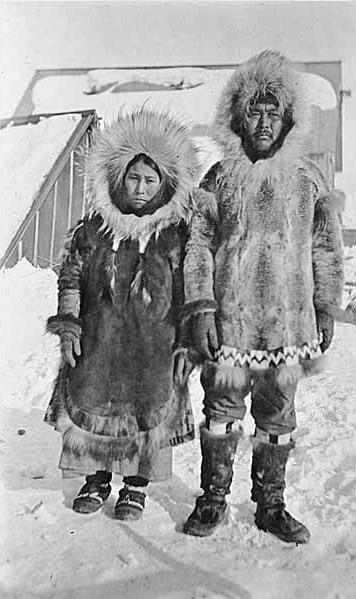 An Inuit couple ready to face the harshest of weather in their fur garments.