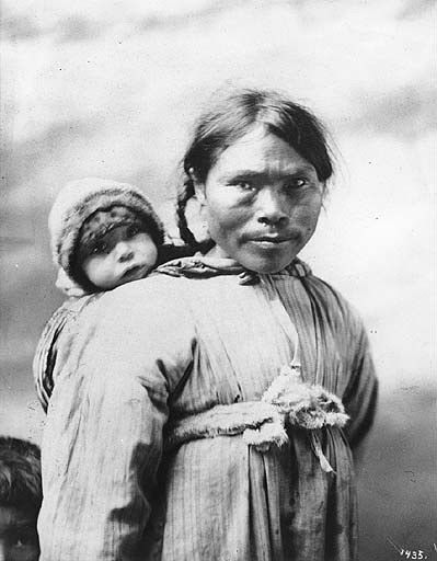 Inuit mother with her little one on her back, Alaska, c. 1901