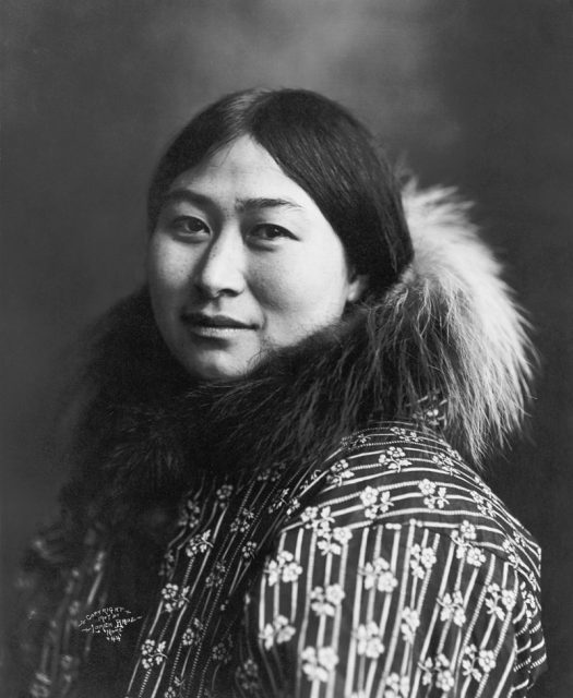 Inuit woman wearing a quilted jacket, Alaska, c. 1907.