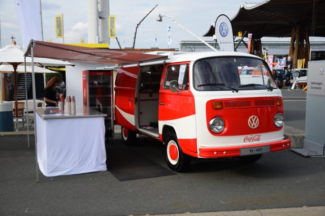 Hannover, Germany – September 21, 2016: Presentation of the classic Volkswagen T2 in Coca-Cola version at a motor show. This vehicle is one of the most popular light commercial vehicles in Europe during the 1960s and 1970s.