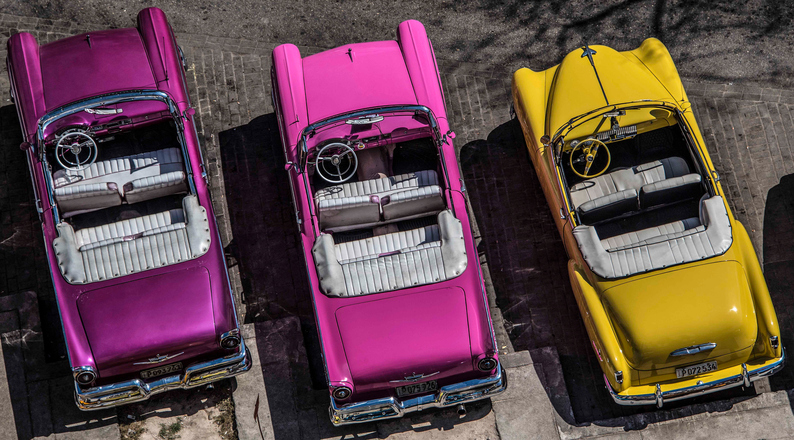 Three vintage cars viewed from above in Havana