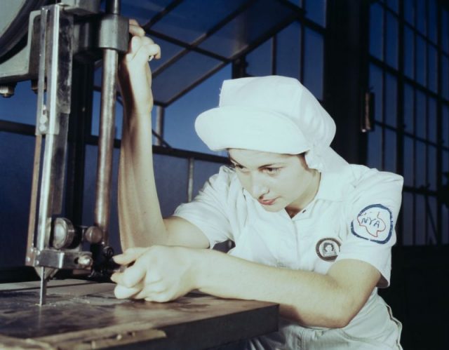 Mildred Webb, another NYA trainee at the Corpus Christi base, also learns how to run a cutting machine.