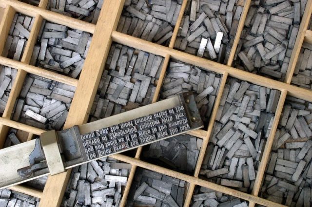 Movable metal type, and composing stick, descended from Gutenberg’s press. Photo by Willi Heidelbach CC By 2.5