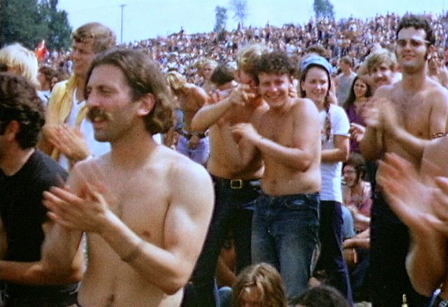 Part of the crowd on the first day of the Woodstock Festival. Photo by Derek Redmond CC BY-SA 3.0