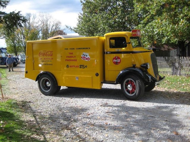 Beautiful yellow Coca-Cola truck. The logo always read in the same font. Photo by JOHN LLOYD CC BY 2.0