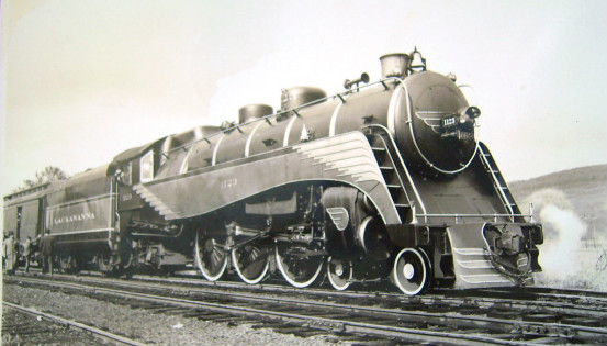 A postcard depicting a 4-6-2 steam locomotive #1123 of the Delaware, Lackawanna and Western Railroad at Norwich, New York.