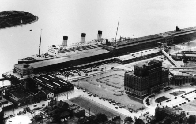 RMS Majestic alongside the Nova Scotian Hotel at Halifax, Nova Scotia, Canada in 1934. Pier 20 is to the left and Pier 21 to the right.