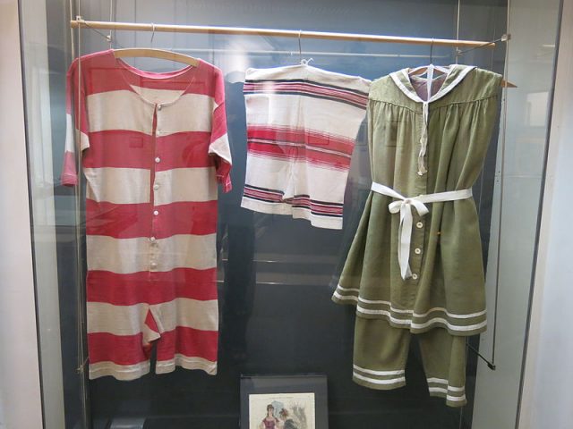 French swimsuits that were used for bathing in the Seine River in Paris during the early 20th century. The pieces on the left and center are male; the one on the right is for females.