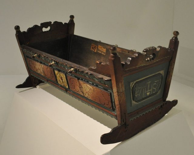 Walnut cradle from 1779, here displayed at Bregenz, Vorarlberg Museum, Germany.