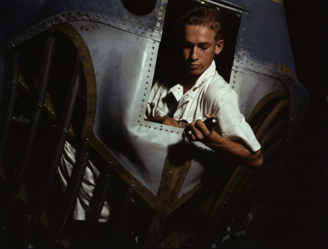Another trainee Elmer J. Pace doing his assignment inside the nose of a PBY navy plane.