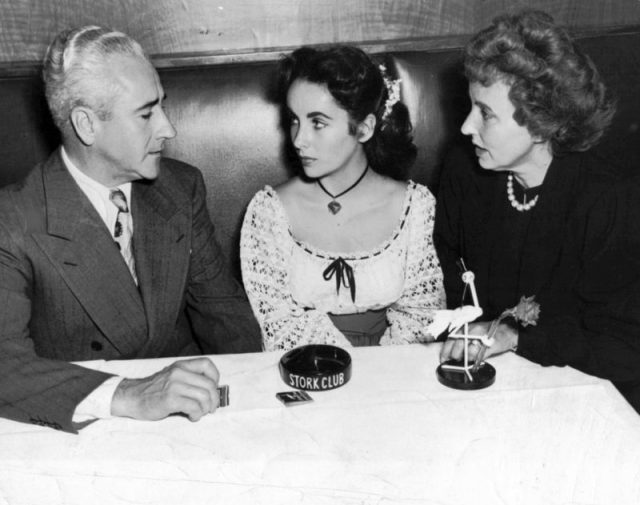 Fifteen-year-old Taylor with her parents at the Stork Club in Manhattan, 1947.