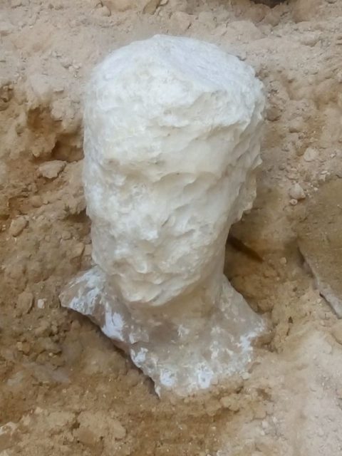 This picture released by the Egyptian Ministry of Antiquities shows the alabaster head of a man found in the ancient tomb dating back to the Ptolemaic period. (Photo credit -/AFP/Getty Images)