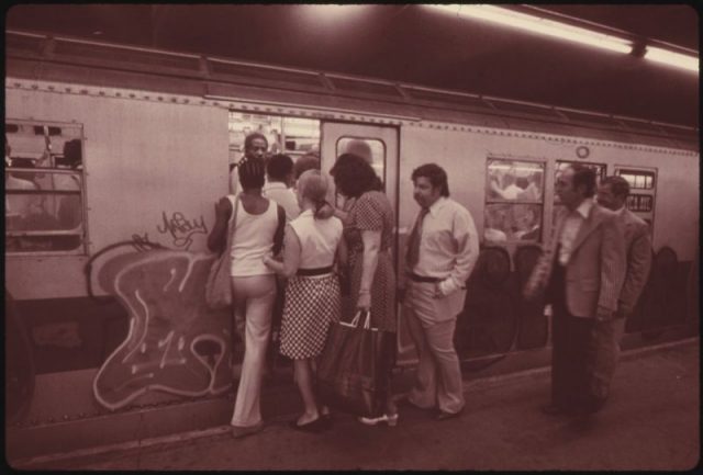 Passengers boarding a subway car on Lexington Avenue line. New York 1973.