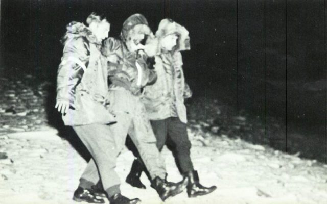 The gunner (center), S. Sgt. Calvin Snapp, is rescued after ejecting onto the ice.