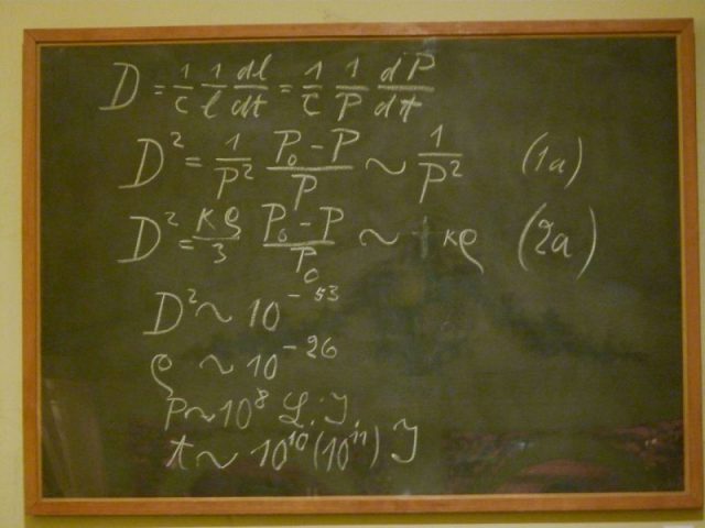 A blackboard used by Albert Einstein in a 1931 lecture in Oxford. The last three lines give numerical values for the density (ρ), radius (P), and age of the universe. The blackboard is on permanent display in the Museum of the History of Science, Oxford. Photo by decltype CC BY-SA 3.0