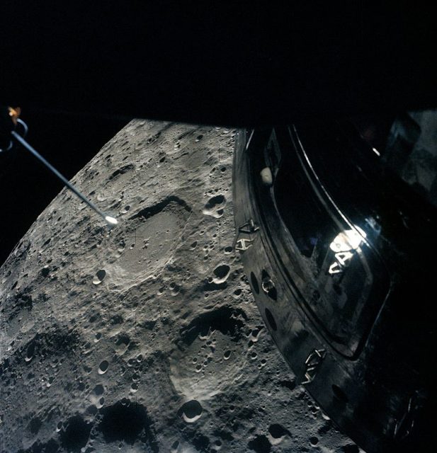 The Apollo 13 crew photographed the Moon out of the Lunar Module overhead rendezvous window as they passed by. The deactivated Command Module is visible.