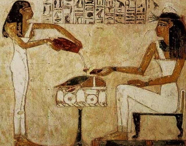 Egyptian hieroglyphics depicting the pouring of beer.