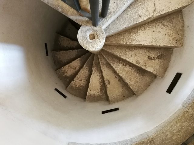 The stone spiral staircase inside Italy’s Rocca dei Rettori.