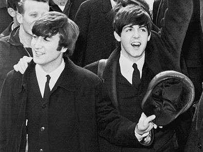 John Lennon (left) and Paul McCartney (right) in 1964.
