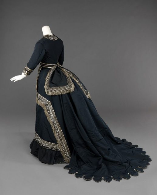 Victorian-style mourning dress with bustle.