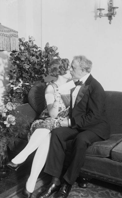 Photo shows Edward Browning kissing his wife, ‘Peaches,’ at a party after receiving a check as a birthday present.