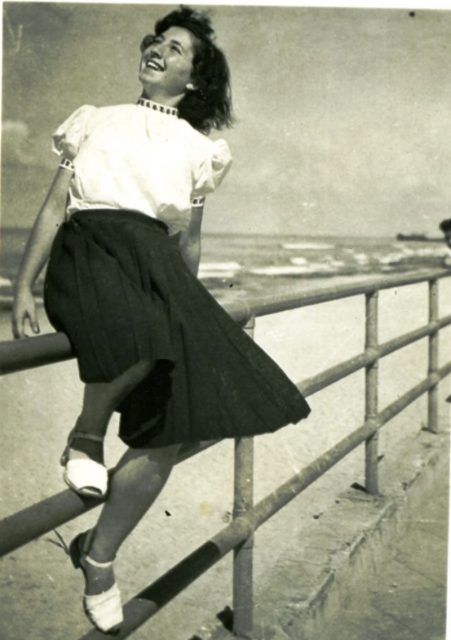 Girl in Tel Aviv, 1950s. Her pleated midi skirt is on-trend for 2018!