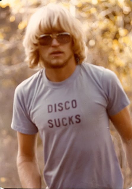Man wearing a Disco Sucks T-shirt. Photo by Rich Lionheart CC BY SA 3.0