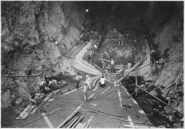 Operations at inlet portal of diversion tunnel No. 2. Invert concrete and trashrack transition base are seen.
