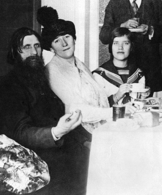 Rasputin with his wife and daughter Matryona (Maria) in his St. Petersburg apartment in 1911.