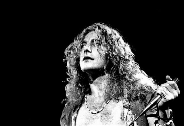 Robert Plant performing with Led Zeppelin, 1973. Photo by Dina Regine CC BY-SA 2.0