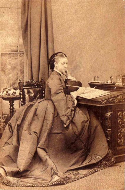Elegant Victorian girl writing a letter