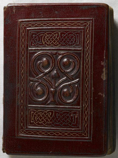 The front cover; the original tooled red goatskin binding is the earliest surviving Western binding.