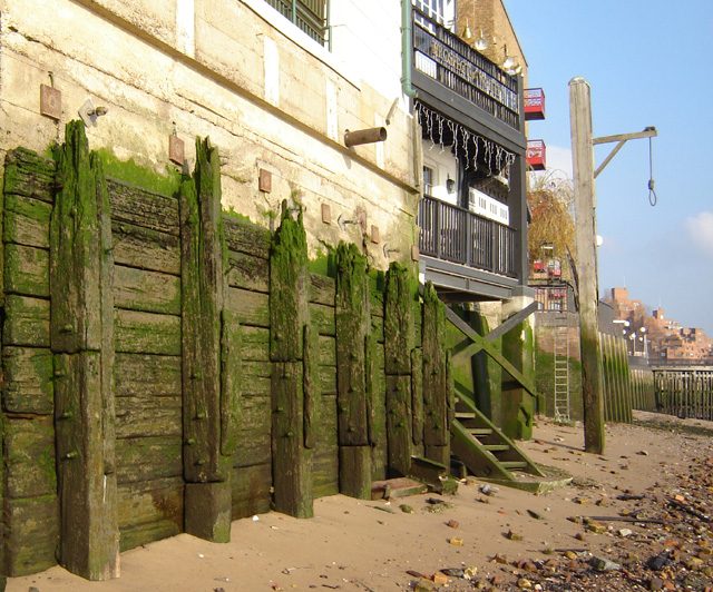 Thames foreshore at Wapping, Tower Hamlets, London, showing Execution Dock gibbet.