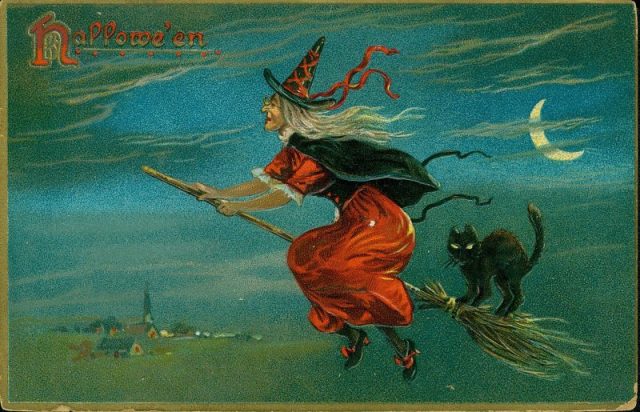 A witch riding a broomstick with a black cat.