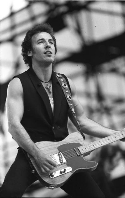 Bruce Springsteen performing on the Tunnel of Love Express Tour at the Radrennbahn Weißensee in East Berlin on July 19, 1988. Photo by Bundesarchiv, Bild 183-1988-0719-38 / Uhlemann, Thomas / CC-BY-SA 3.0