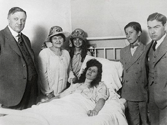 After emerging from the Mexican desert, McPherson convalesces in a hospital with her family in Douglas, Arizona, 1926.