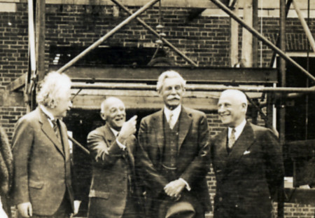 Einstein, Flexner, John R. Hardin, and Herbert Maass at the laying of the Fuld Hall cornerstone, at the Institute for Advanced Study on May 22, 1939. Photo by Unknown photographer – Shelby White and Leon Levy Archives Center, Institute for Advanced Study, Princeton, NJ, USA