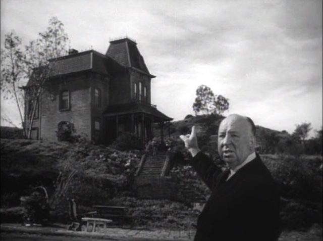 Alfred Hitchcock showing Norman Bates’ house, in Psycho’s trailer.