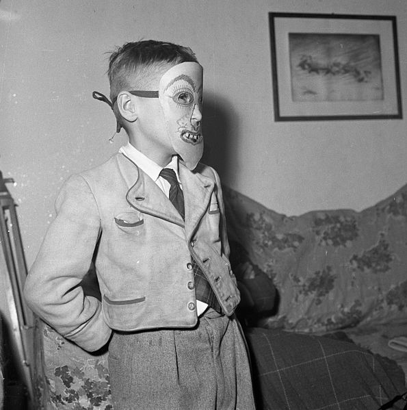 Boy with a creepy mask. Photo by Fortepan CC BY SA 3.0