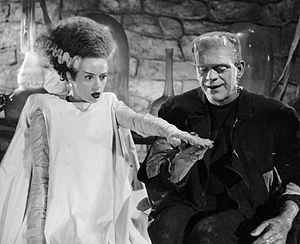 Elsa Lanchester and Boris Karloff in Bride of Frankenstein. The bride’s conical hairdo, with its white lightning-trace streaks on each side, has become an iconic symbol of both the character and the film.