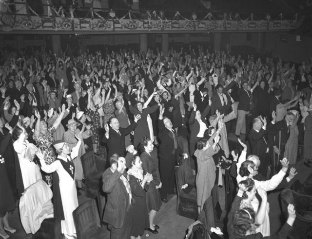 Congregation at Angelus Temple during fourteen-hour Holy Ghost service led by Aimee Semple McPherson, Los Angeles, California, 1942.