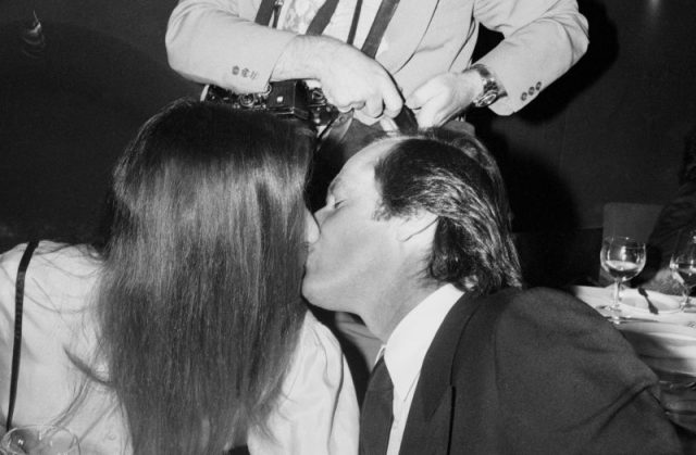 Jack Nicholson kissing Anjelica Huston at a formal dinner, c. 1970, New York. Photo by Art Zelin/Getty Images